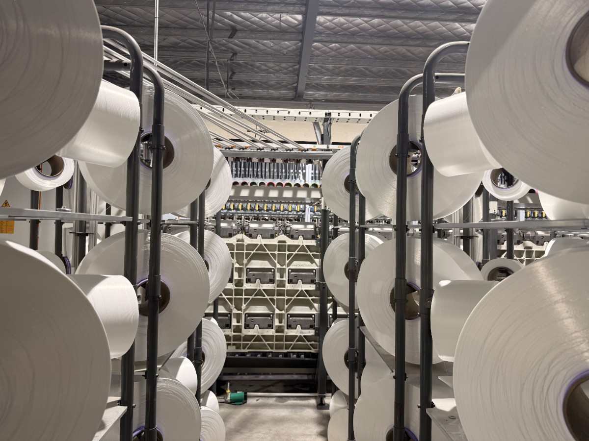 Finished DTY cone yarn packages on the racks